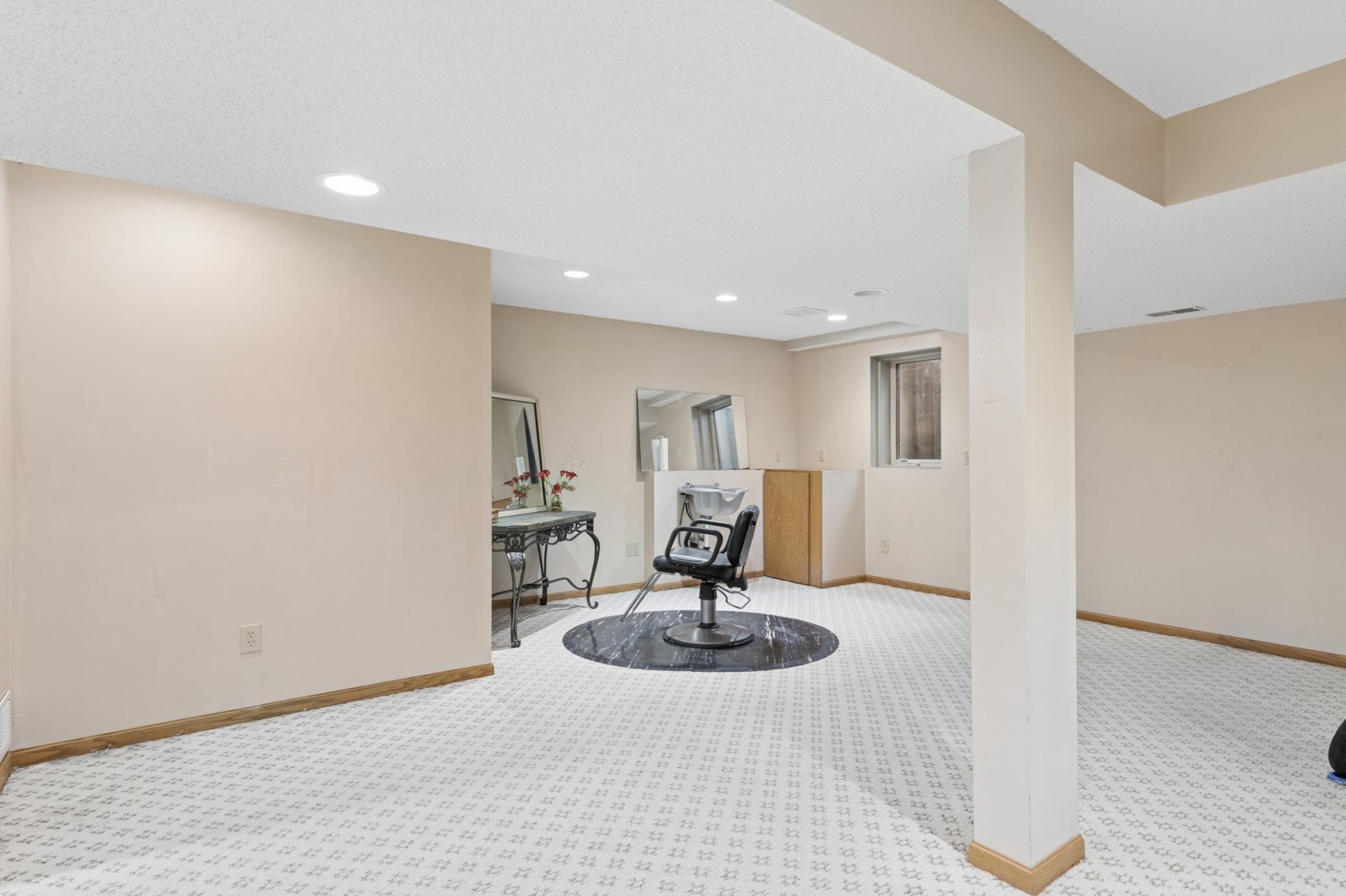 Bring your ideas for this 4th level flex room with egress window. The plumbing is there for a wet bar or kitchenette. Second full laundry in the utility room located just off this space.