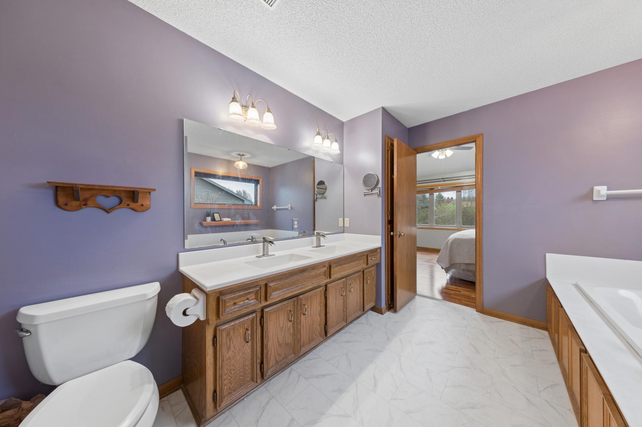 Dual sinks and loads of cabinet space and linen closet.
