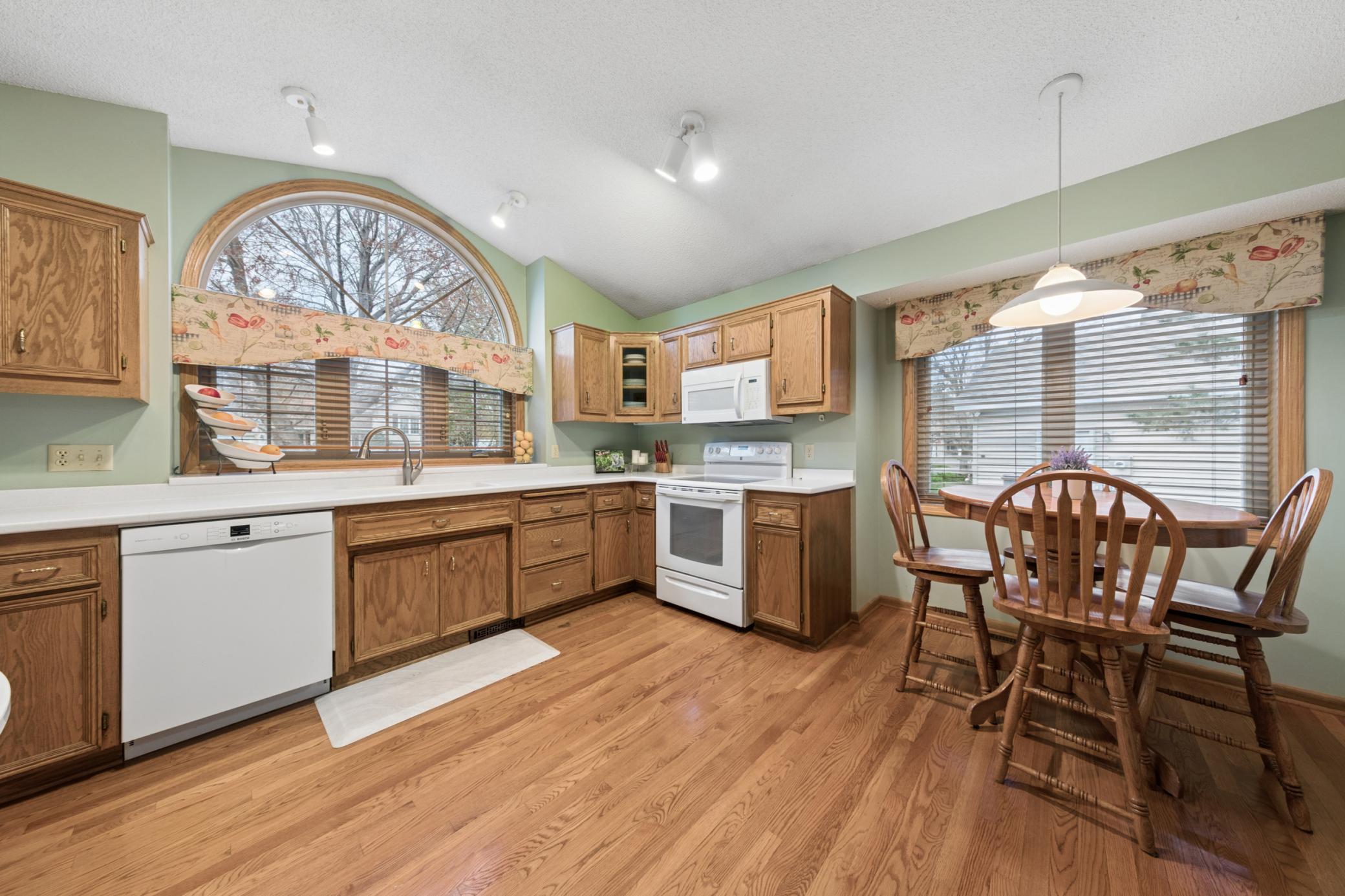 The large kitchen is loaded with natural light. Loads of cabinet and counter space. True hardwood floors.
