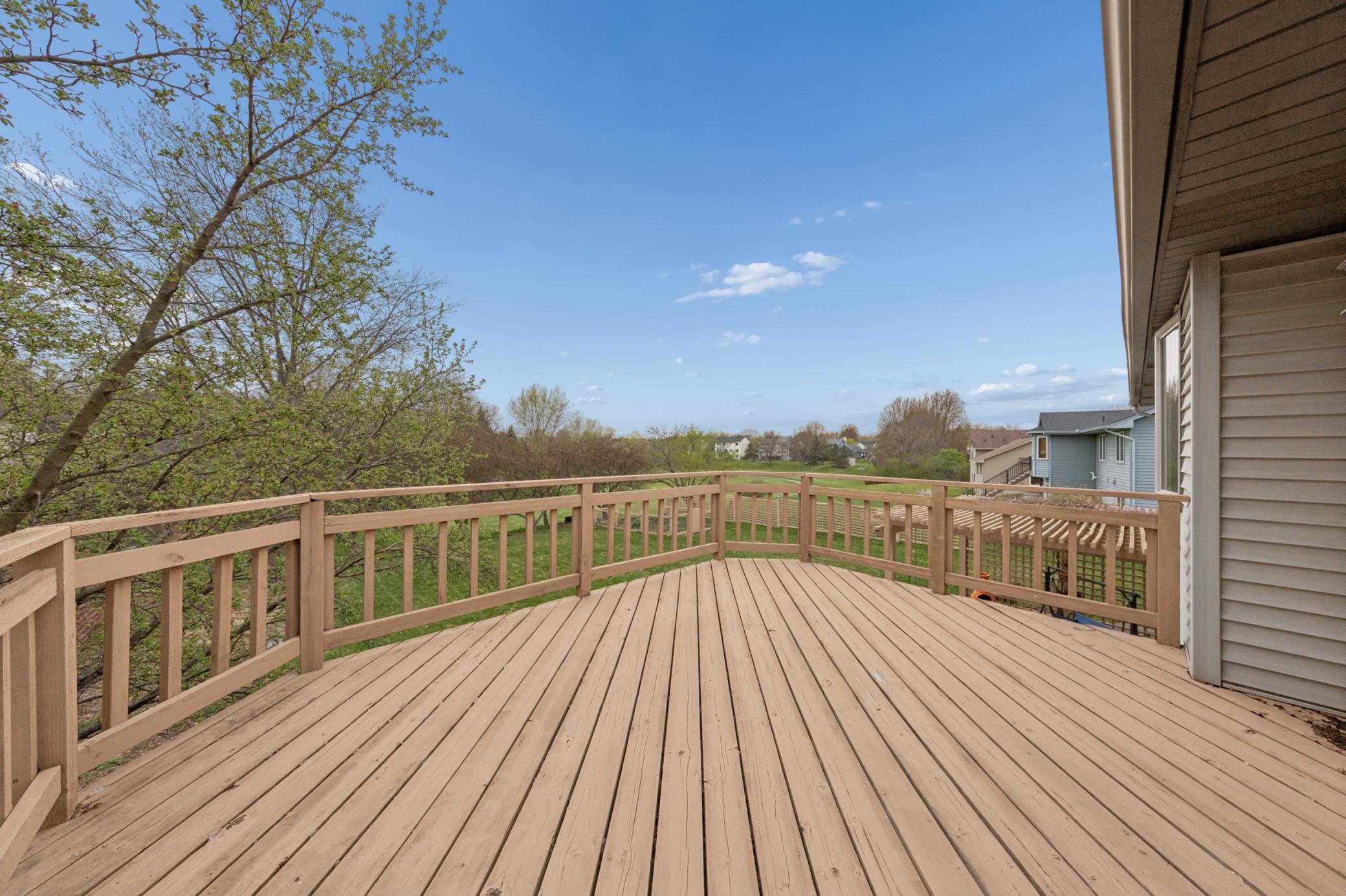 Plenty of room for gathering and grilling on the large deck overlooking the backyard.