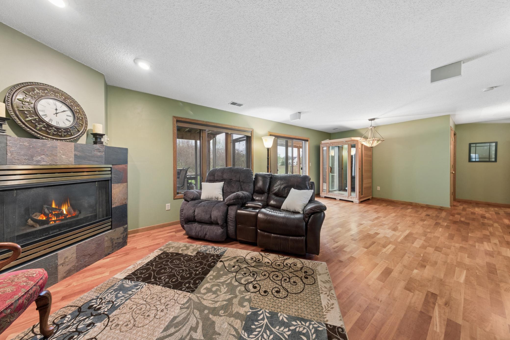 The walk out lower level is complete with a gas fireplace and hardwood floors.