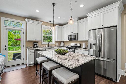 white cabinets w/ stainless steel appliances