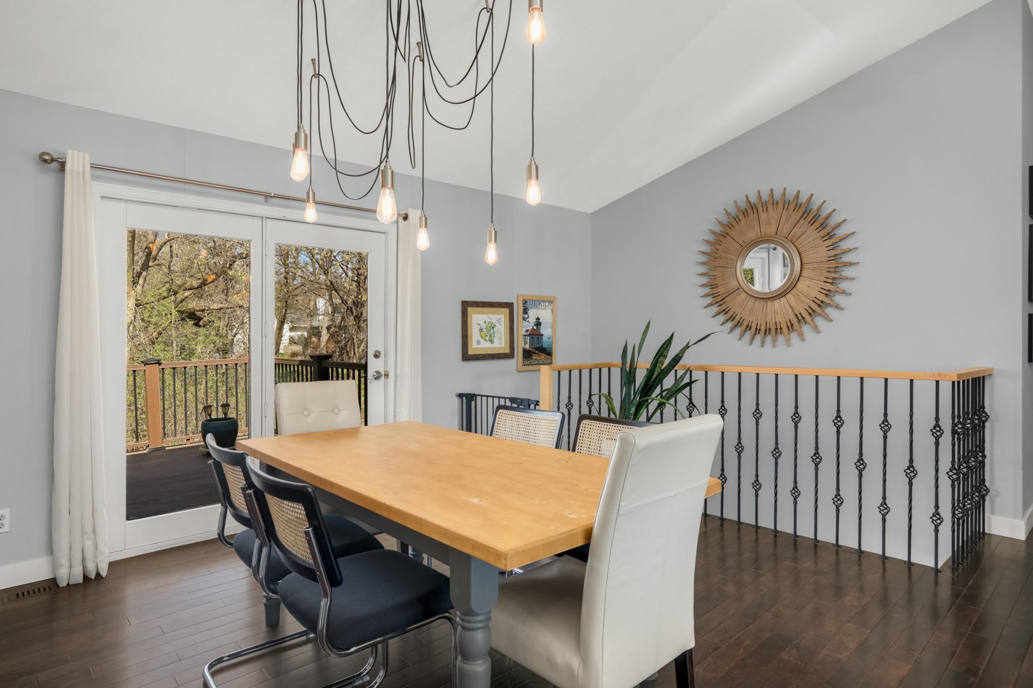 Dining room that leads out to a maintenance free deck