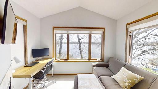 Primary suite sitting room with fireplace.