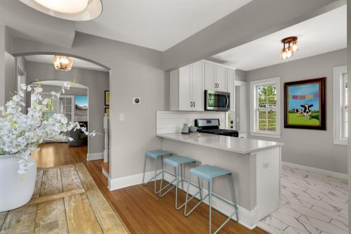 Eat in kitchen with peninsula and counter stools, the gathering place of the home
