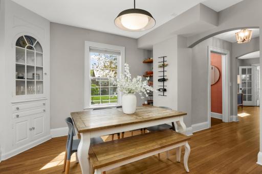 Formal dining space with custom built-in storage and shelves