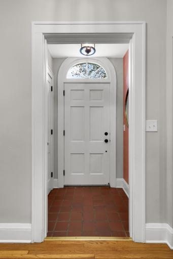 Separate Foyer/ Entryway with coat storage, and accent wallpaper