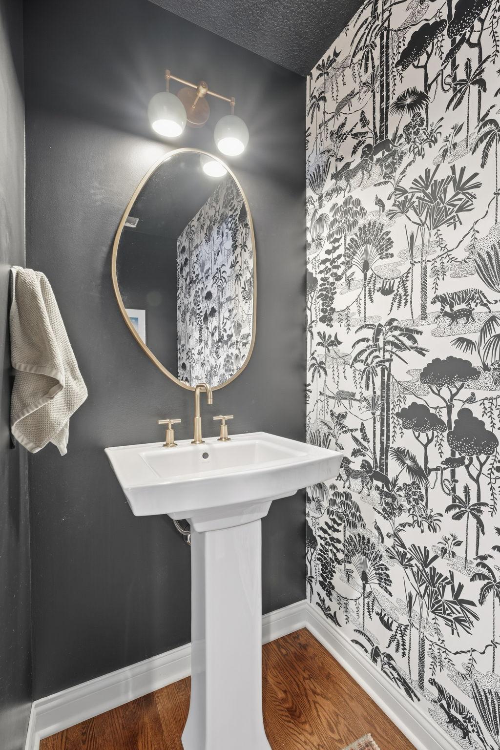 This unique powder bathroom is located in the hallway close to the kitchen area.