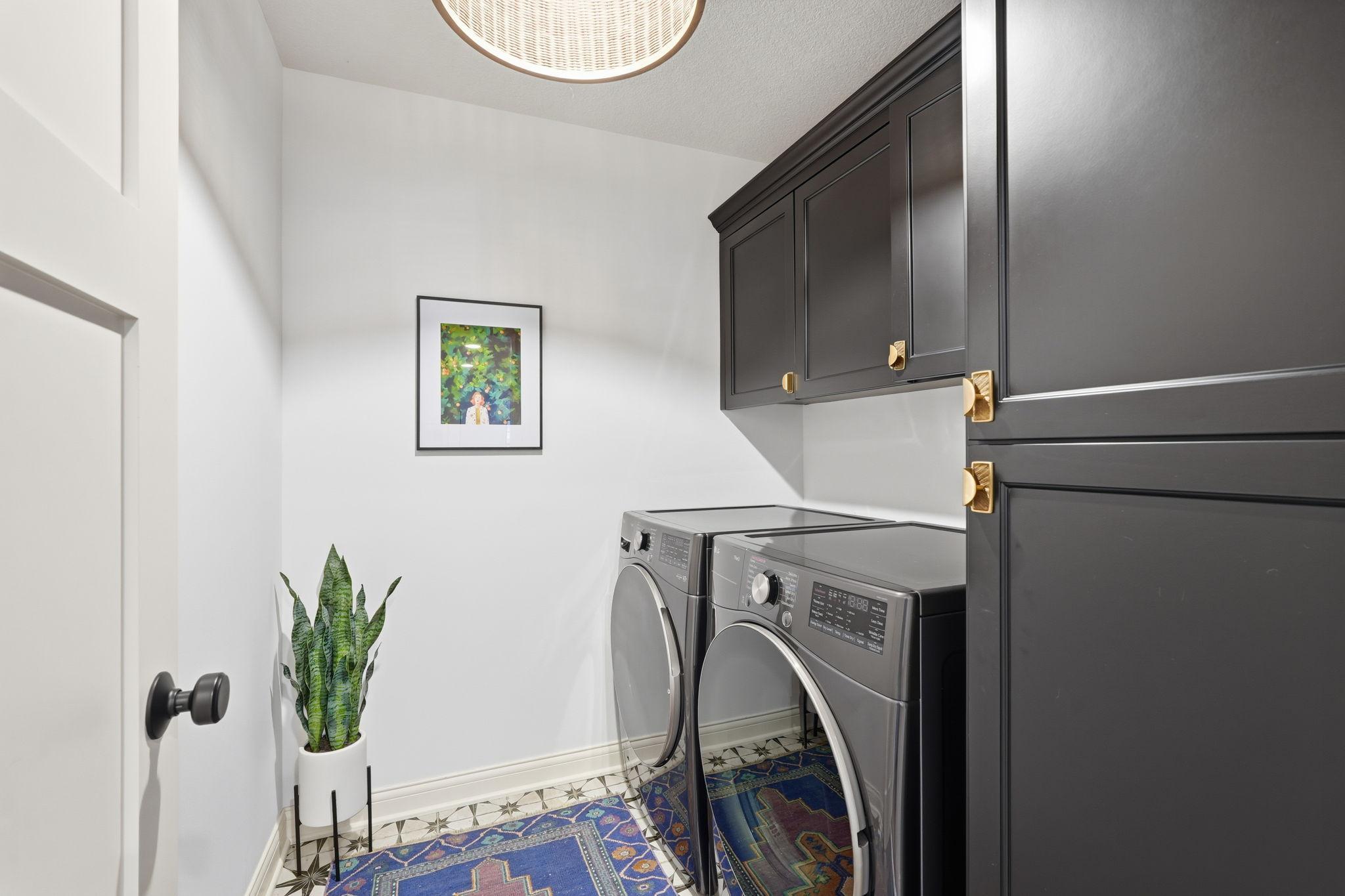 Main floor laundry room offers ease and convenience as it's located close to the primary bedroom.