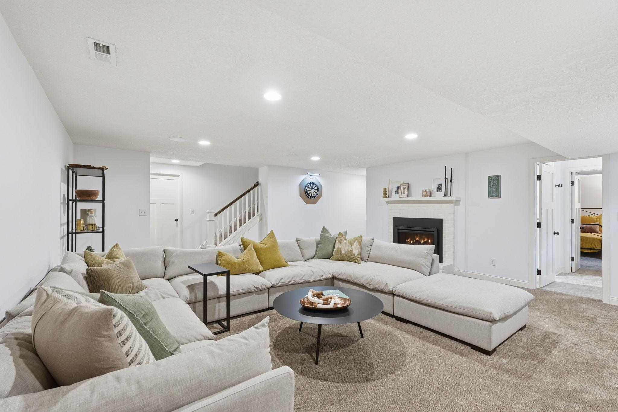 Lower level family room is perfect for cozy nights in by the fire.