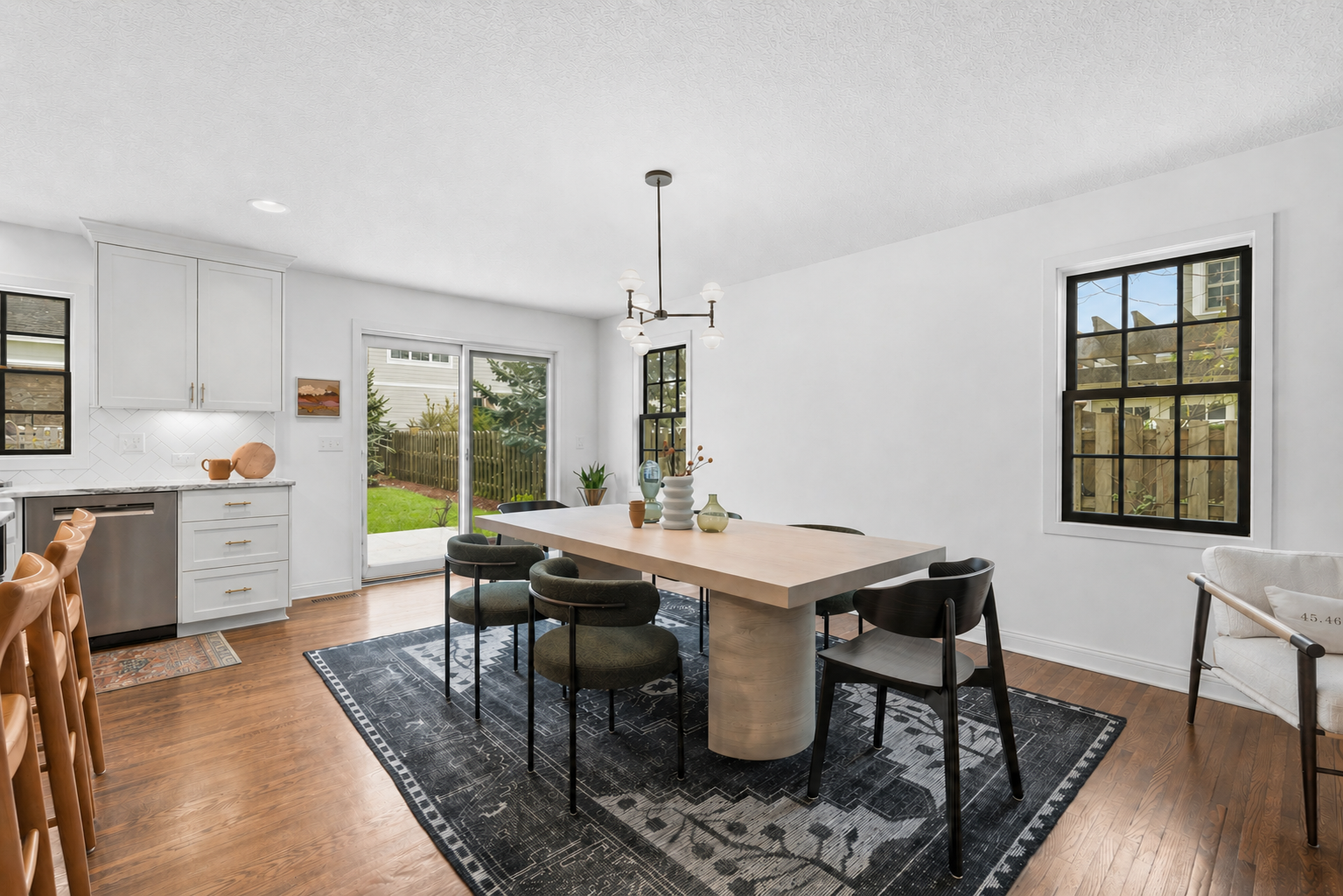 Flowing effortlessly into a spacious dining area with direct outdoor access, it represents the perfect marriage of organic warmth and modern sophistication.