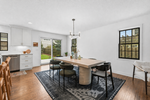 Flowing effortlessly into a spacious dining area with direct outdoor access, it represents the perfect marriage of organic warmth and modern sophistication.