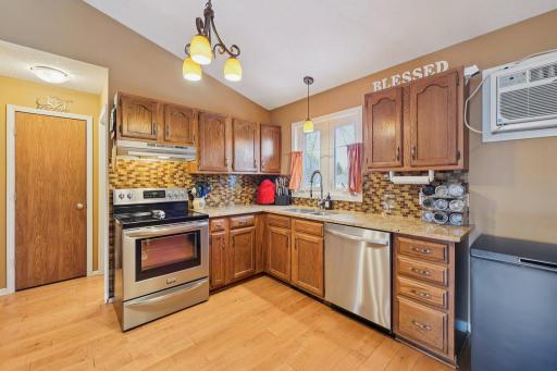To the right of the hall pantry is a large half bath