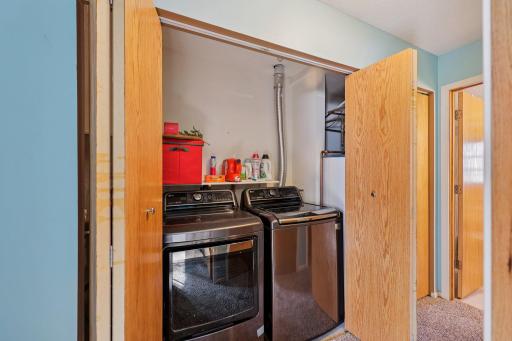 Newer washer and dryer, plus storage tucked under the front entry to the left of the dryer