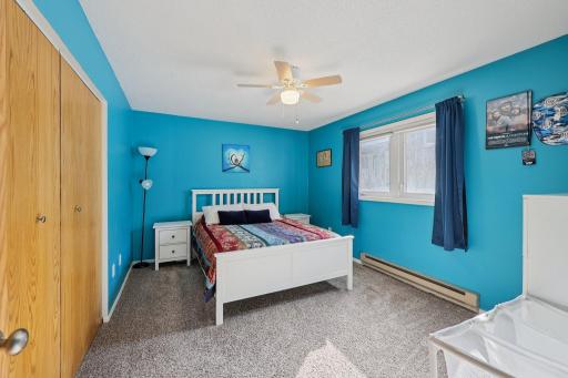 Large primary bedroom with east-facing windows
