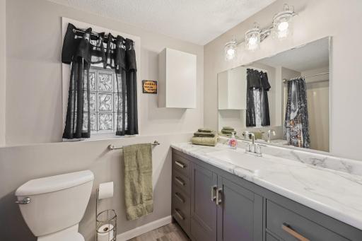 Lower level full bath at the end of the hall