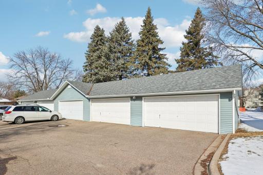 4th garage to the left in this photo. The 2 car garage has a newer door and opener, and has electric. The garage for this unit has the house numbers on it.