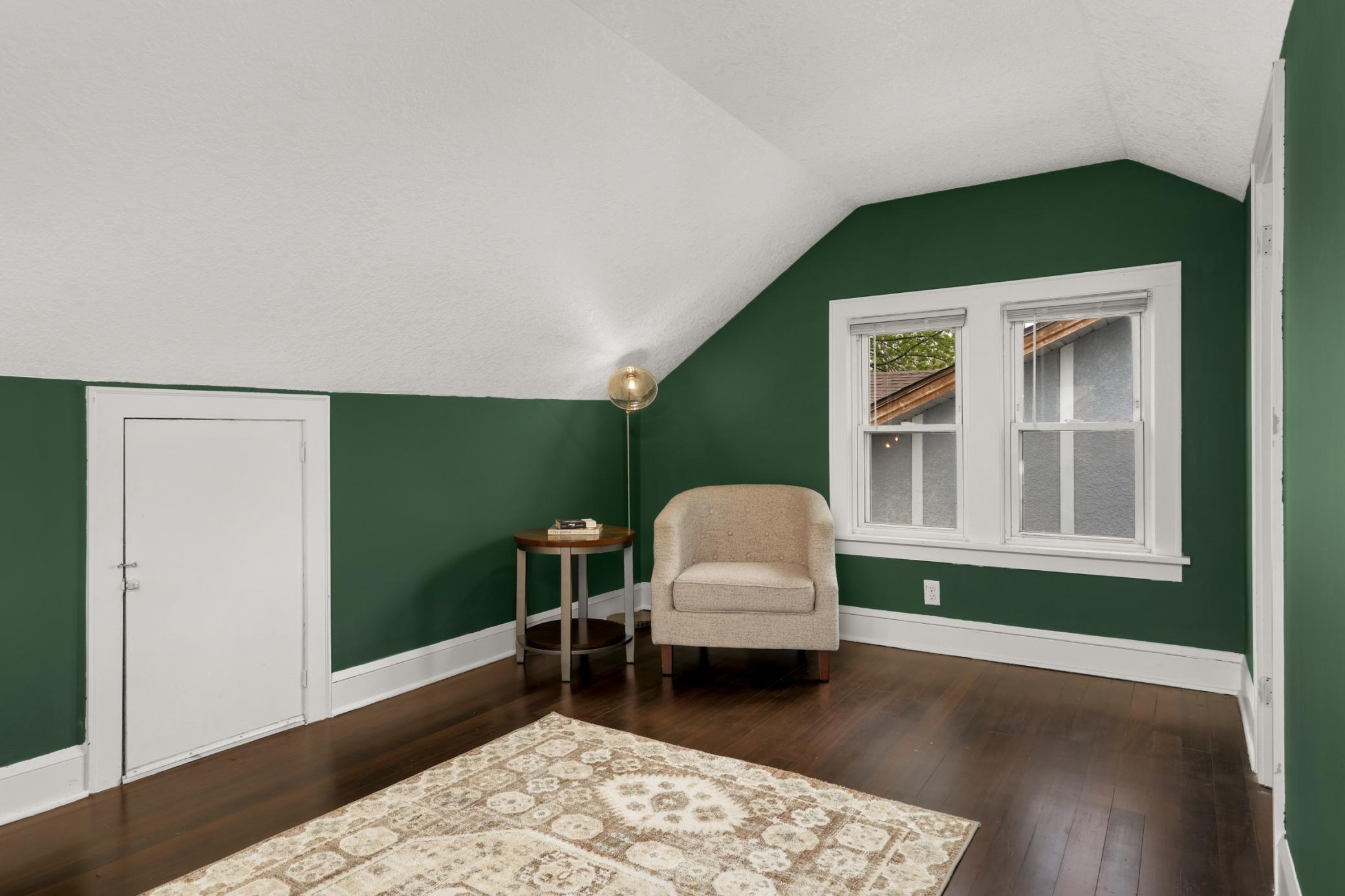 Adorable seating area in the primary bedroom.