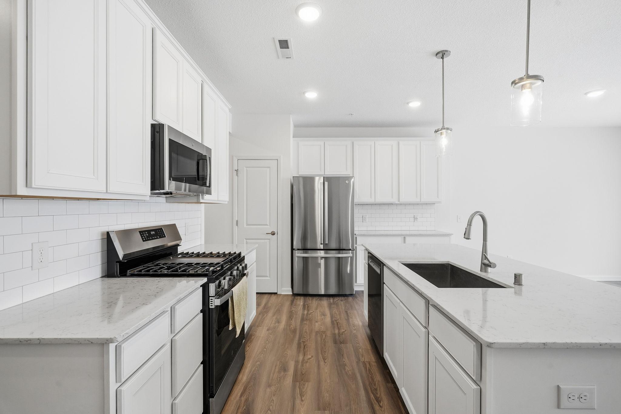 Gorgeous kitchen with new appliances and a large center island