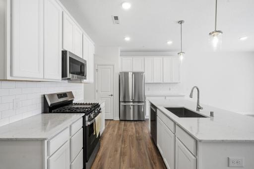 Gorgeous kitchen with new appliances and a large center island