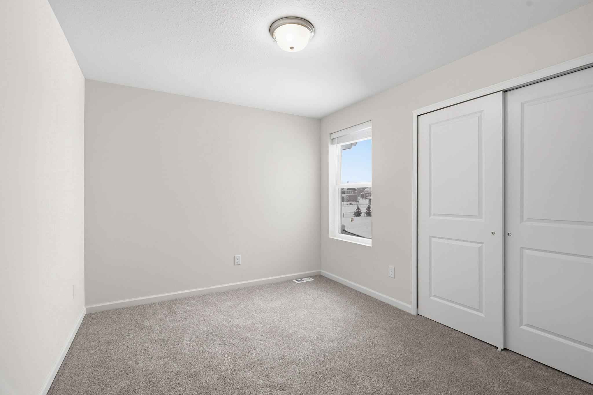 Bedroom 2-bedrooms 2 & 3 are tucked at the other end of the upper level from the primary