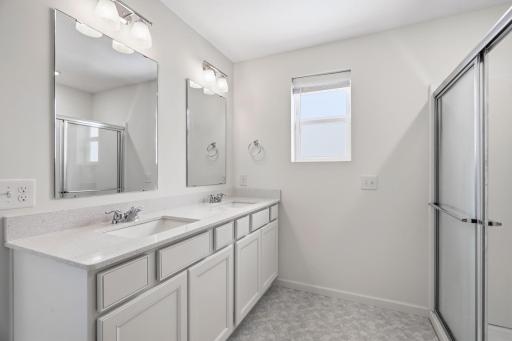Primary ensuite with double sinks and large shower