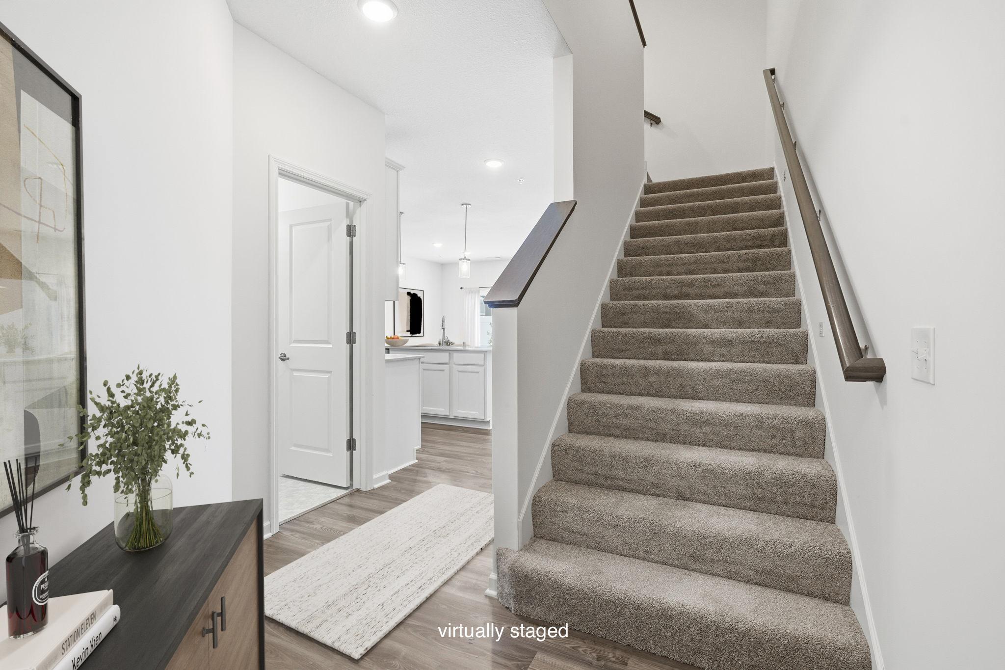 Just past the front entry the home opens up to welcome you in