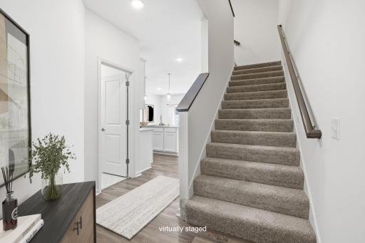 Just past the front entry the home opens up to welcome you in