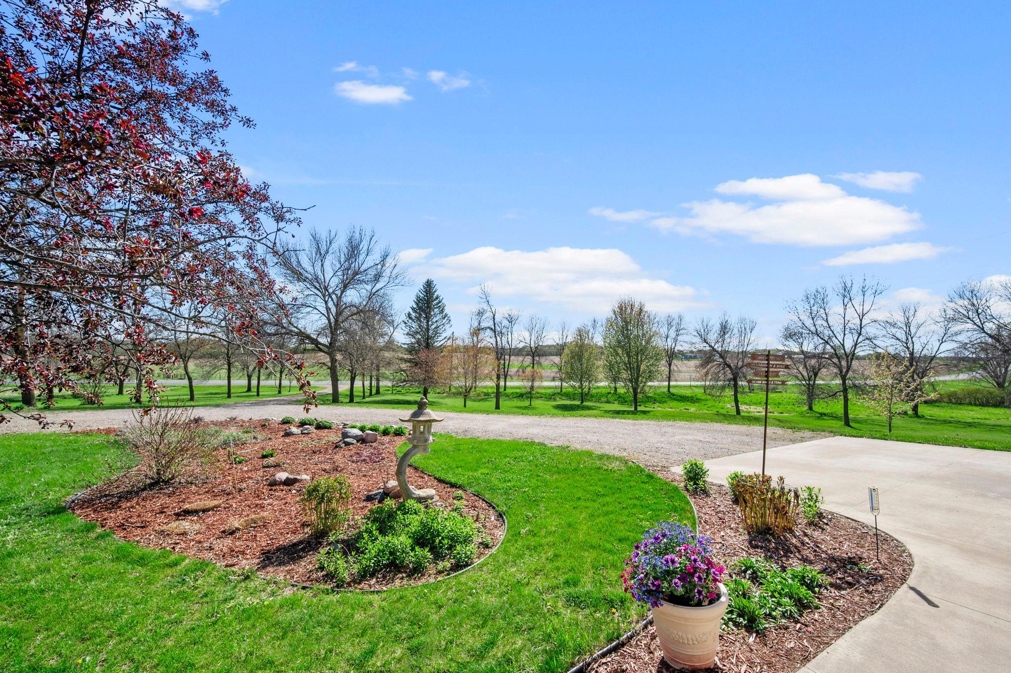 Perrenials surrounding the home mean yearly blooms and low maintenance hostas. 21650 Oakdale Dr, Corcoran, MN