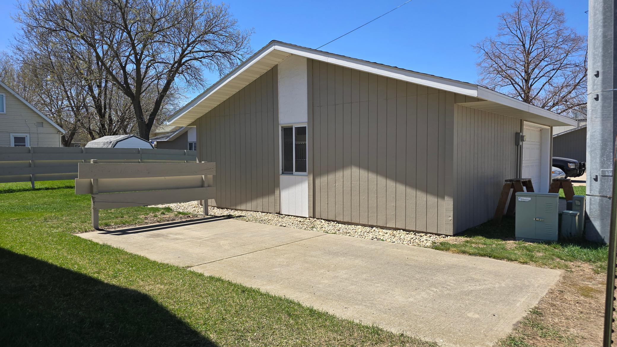 Extra detached garage and cement parking pad