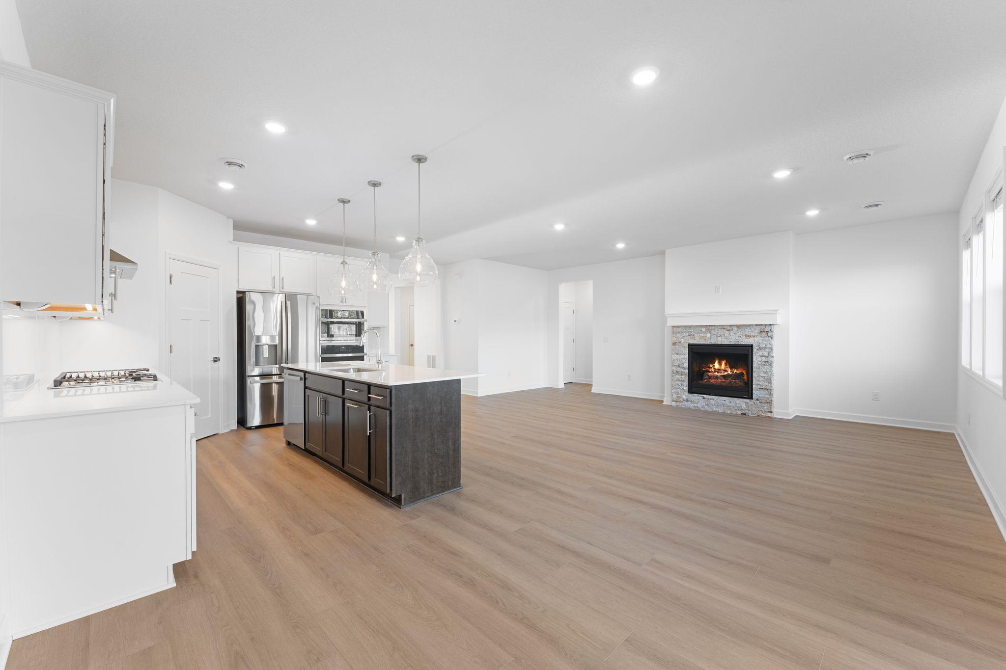 The dining room embraces natural light from a sliding glass door, creating a welcoming space for dinner parties and special occasions.