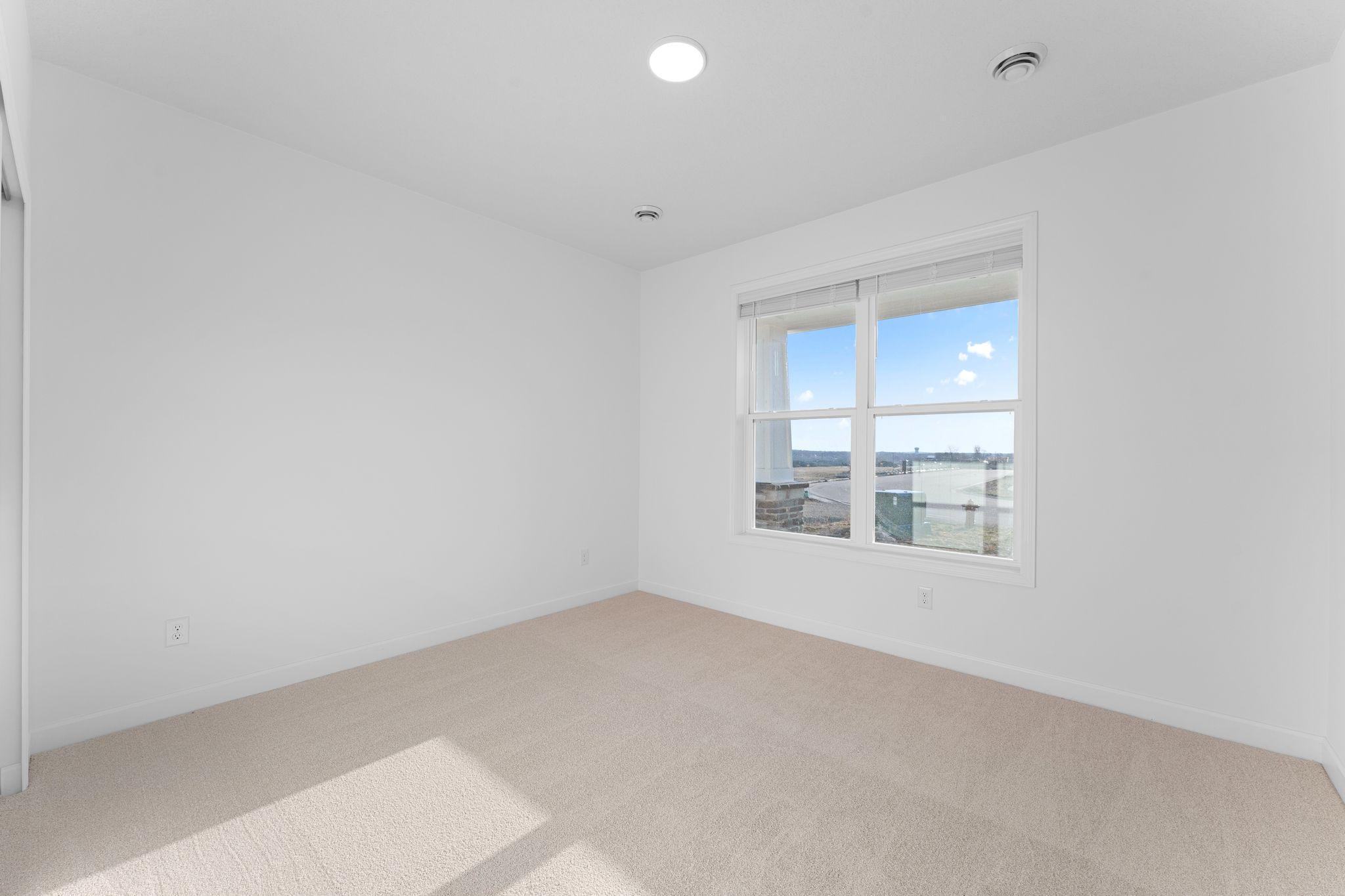 The two secondary bedrooms are situated down the hallway from the owner’s suite to provide secluded retreats after a long day.