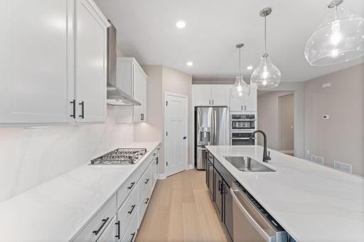 The center island has an open line of sight to the Great Room and dining room in an ideal set-up for modern living