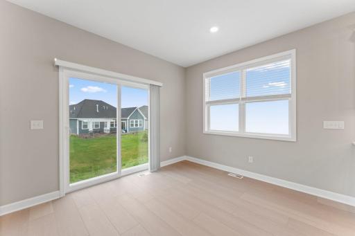 A sliding glass door offers simple outdoor access for al fresco dining options and much more