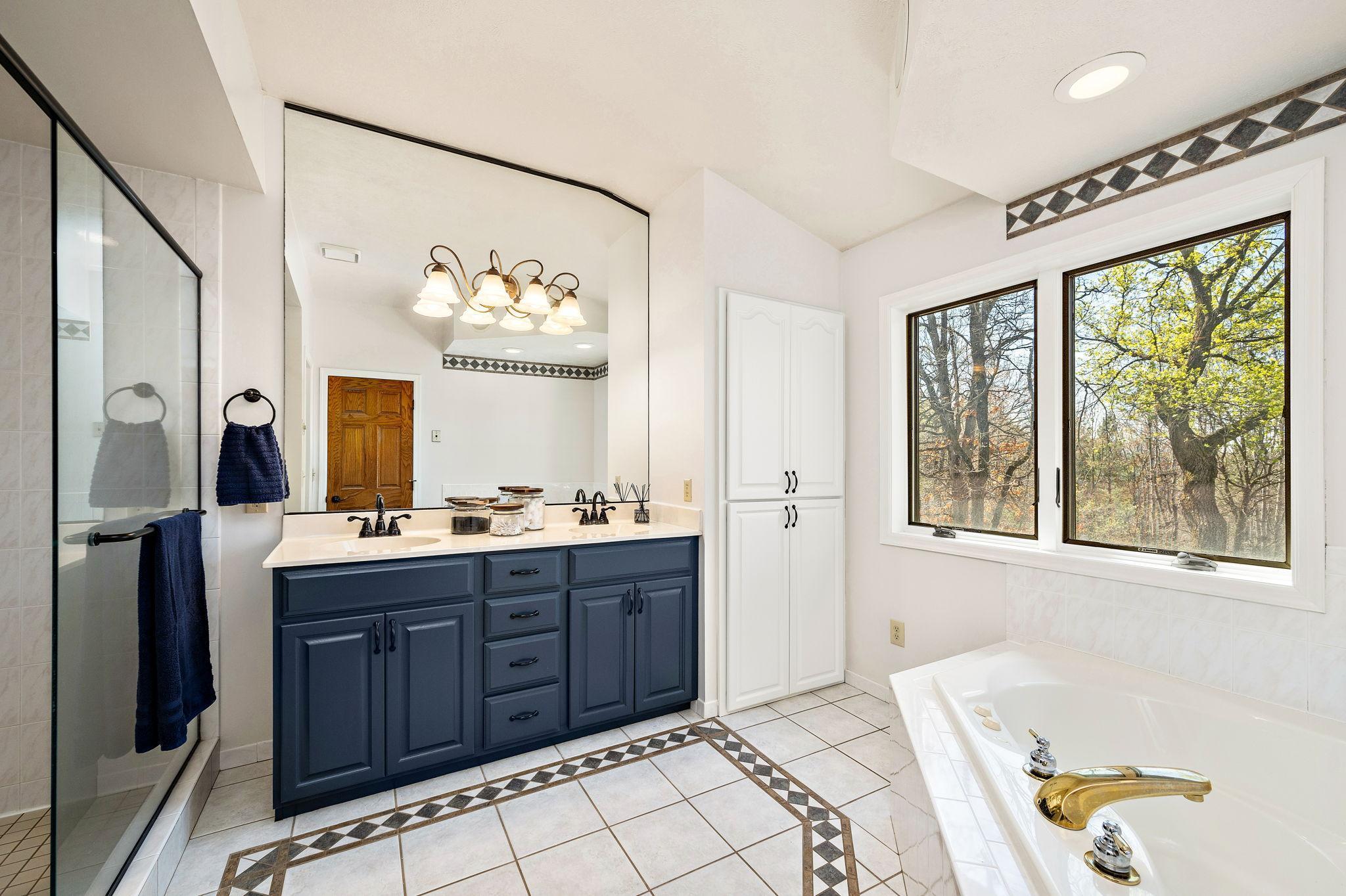 Owner suite bathroom with double sinks
