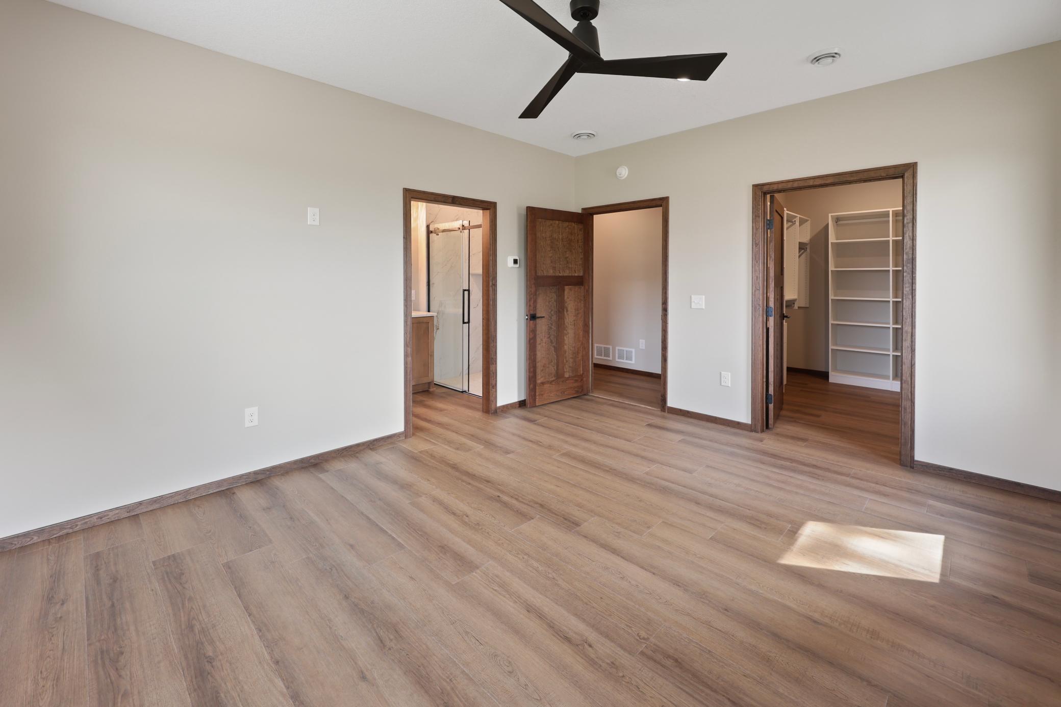 Primary bedroom with custom closet