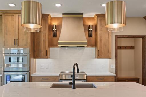 The range hood with side sconces offer a touch of class