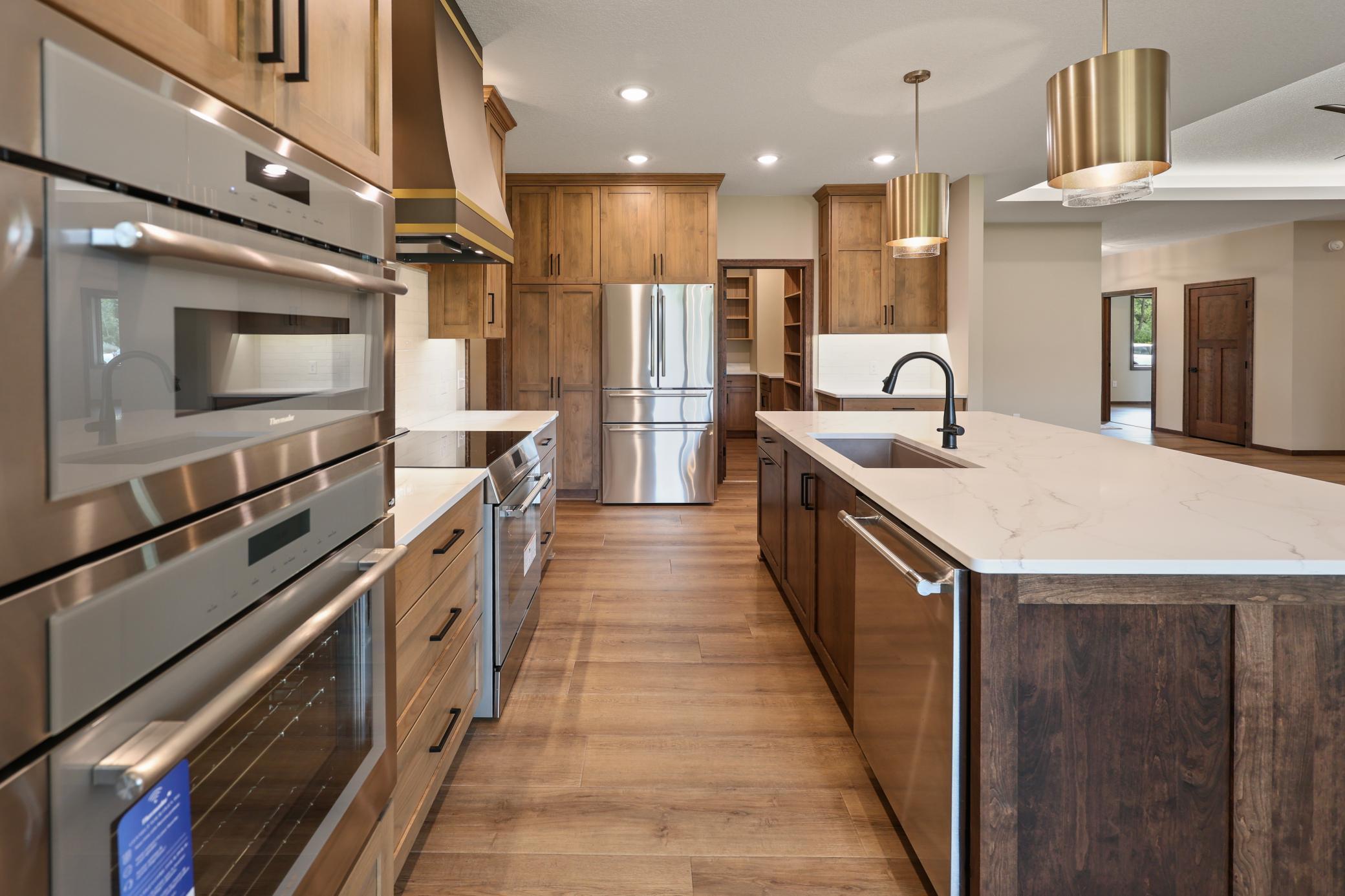 The gourmet kitchen features double wall oven