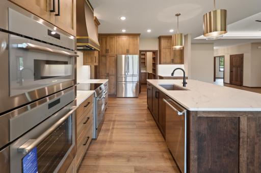 The gourmet kitchen features double wall oven