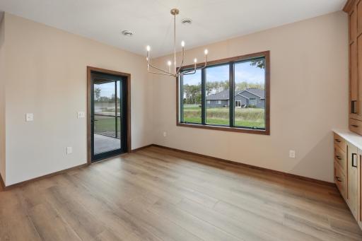 Dining room leading to the screened patio and private backyard