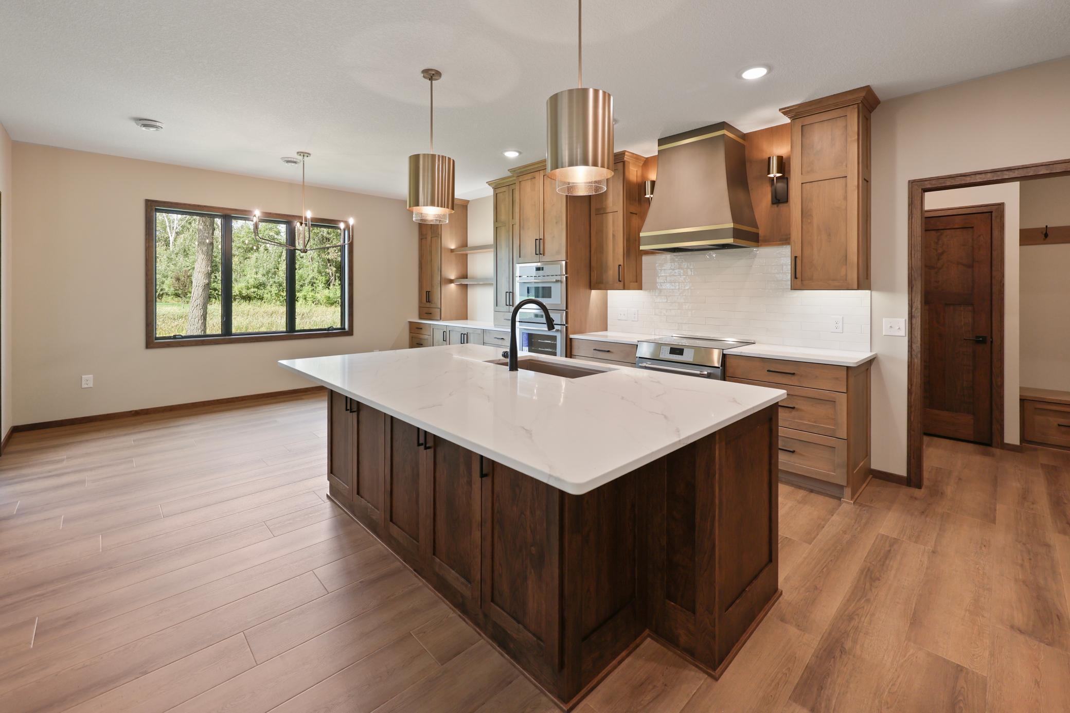 Oversized quartz island with beautiful fixtures