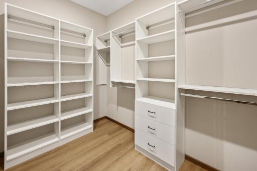 Custom walk in closet in primary bedroom