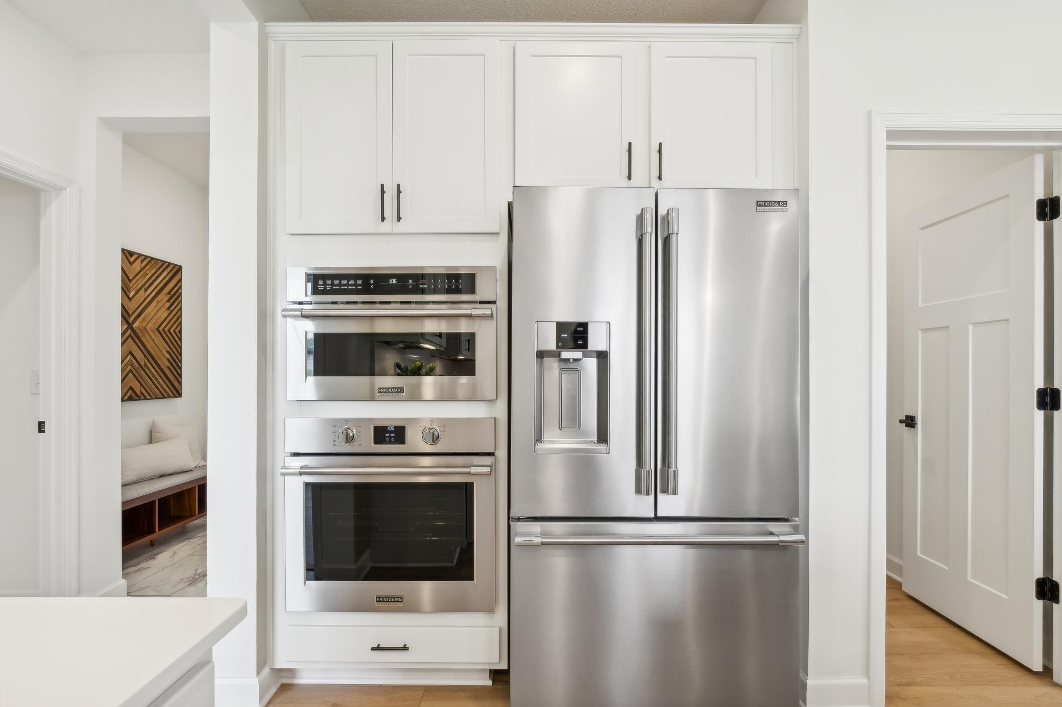 (Photo of model home, finishes will vary) A brand-new stainless steel wall oven and microwave elevate cooking experiences in this gourmet kitchen layout