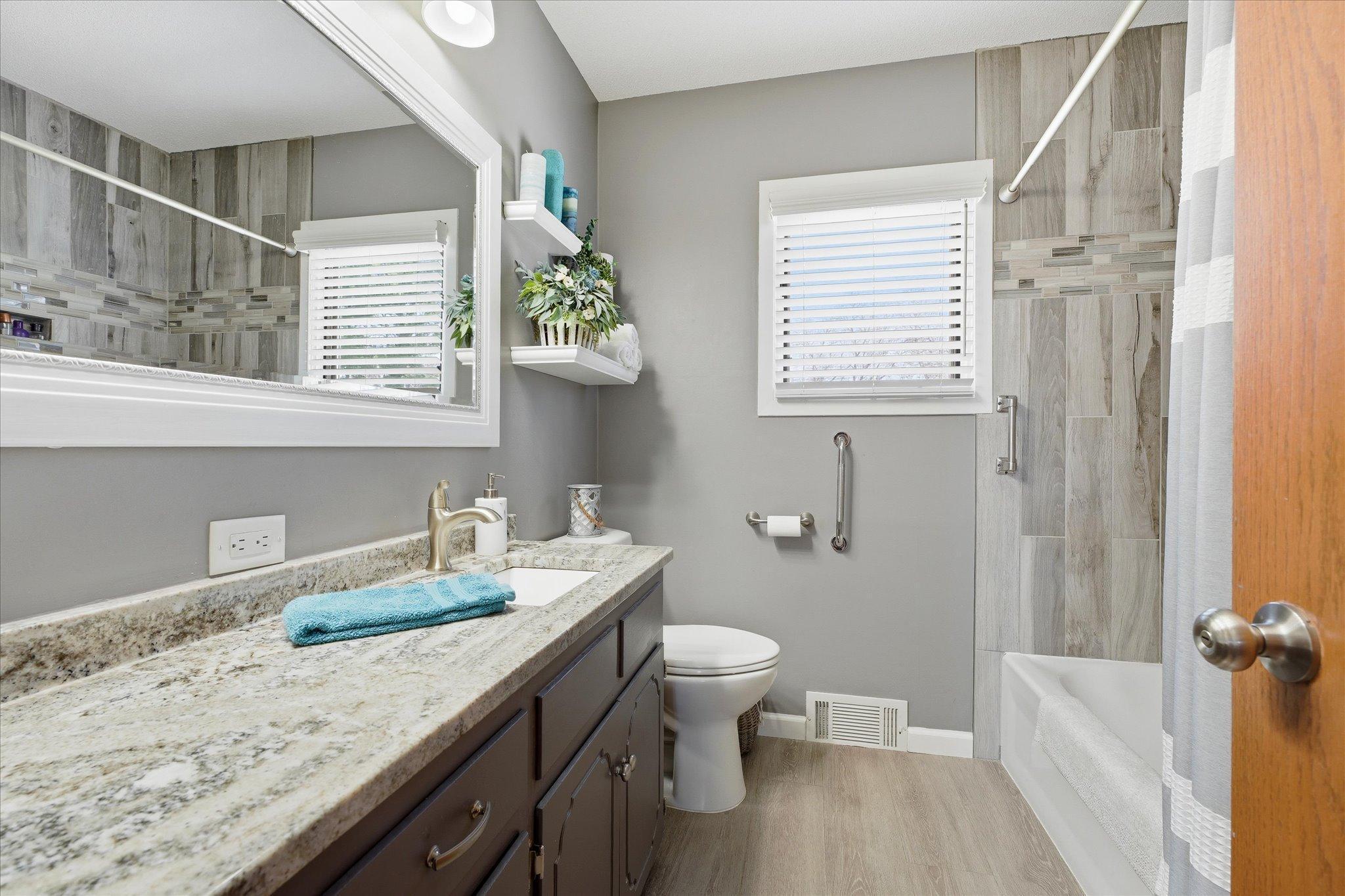 The main floor bathroom has been beautifully remodeled including a gorgeous tiled bath/shower.