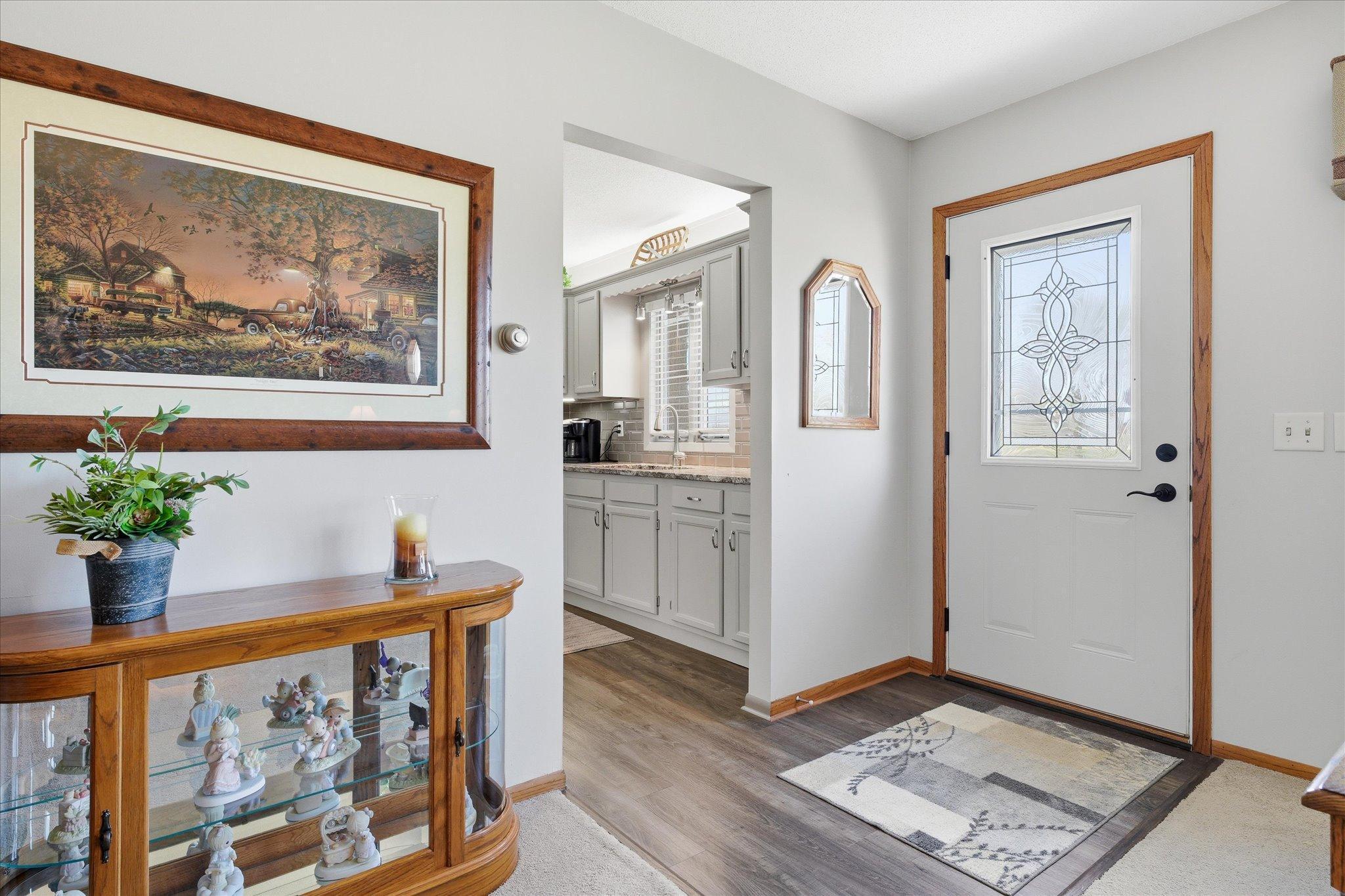 The large foyer area opens to the living room and kitchen area.