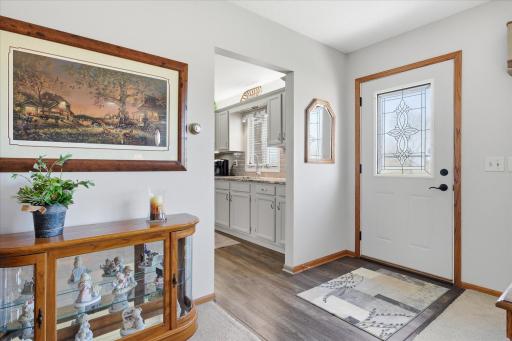 The large foyer area opens to the living room and kitchen area.