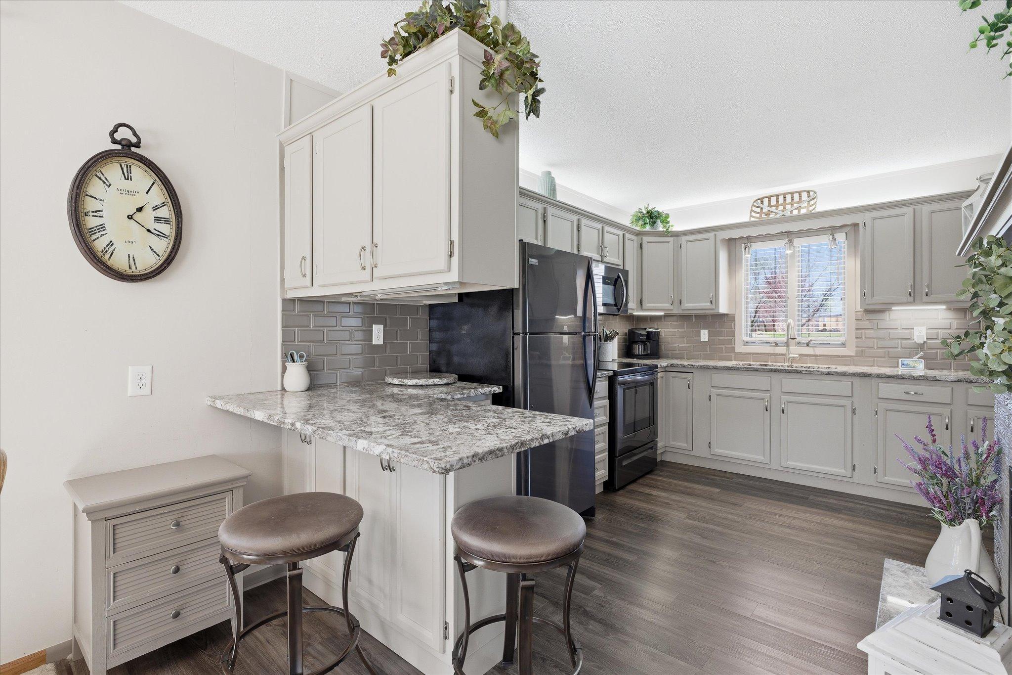Notice all the cabinetry for storage needs plus wonderful counter space and a breakfast nook for snacks and light meals.