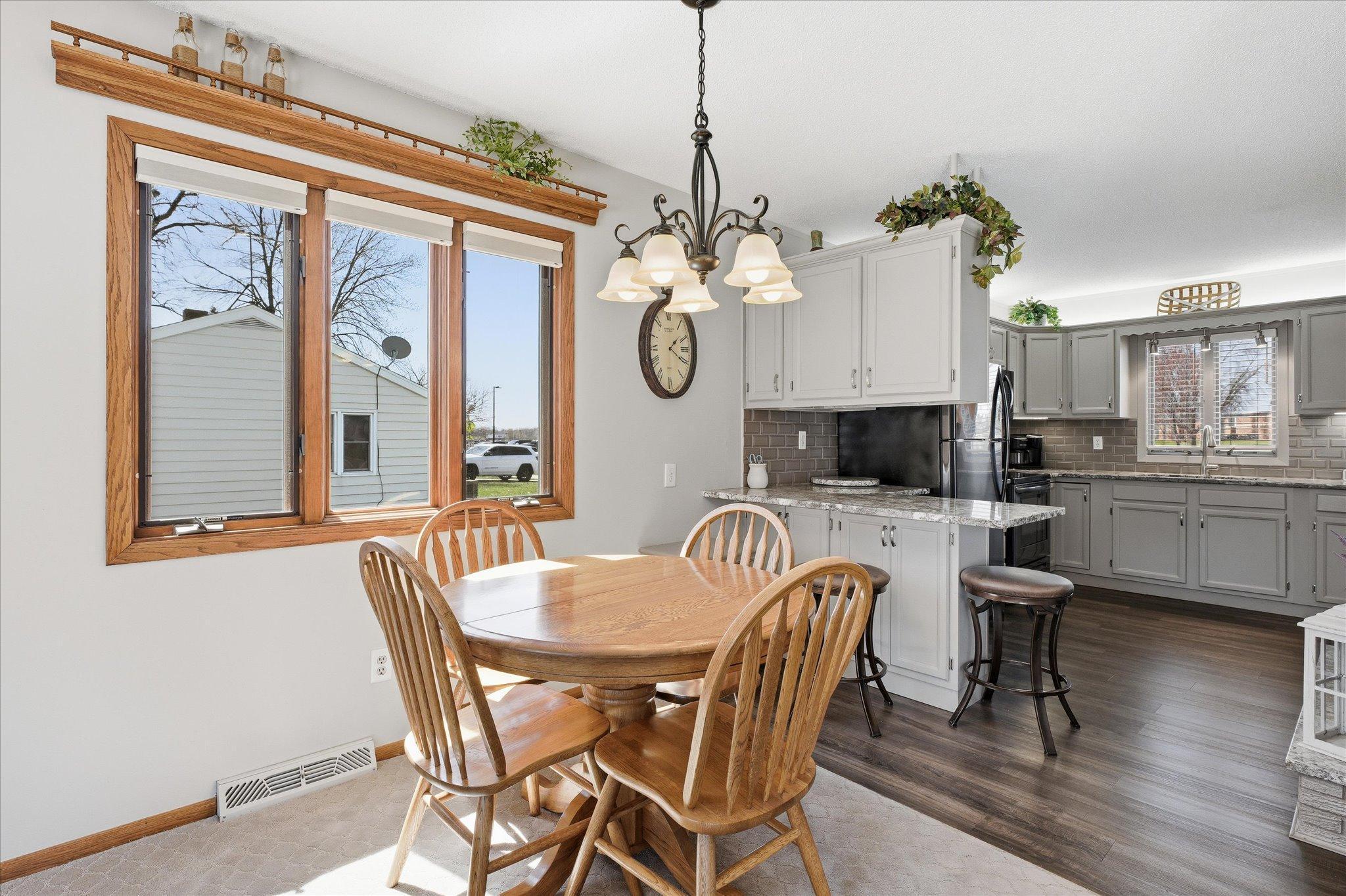 The dining room area is open to the kitchen and family room. Large windows for plenty of light throughout the home.