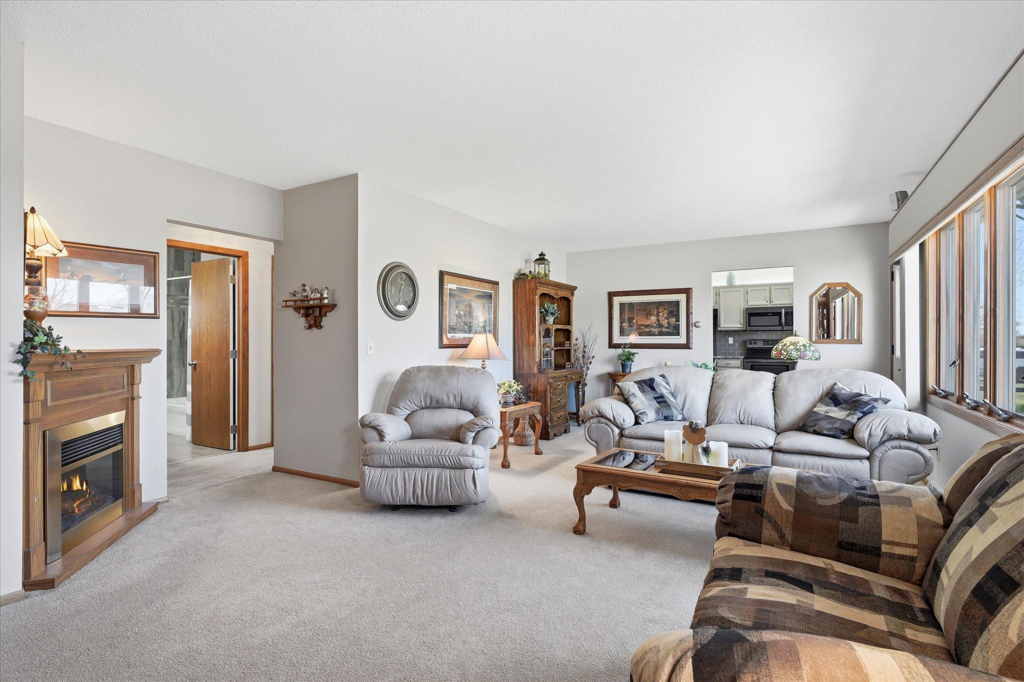 The corner fireplace is electric and free standing and does go with the home.