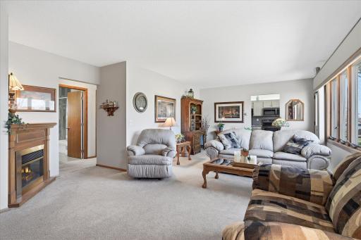 The corner fireplace is electric and free standing and does go with the home.